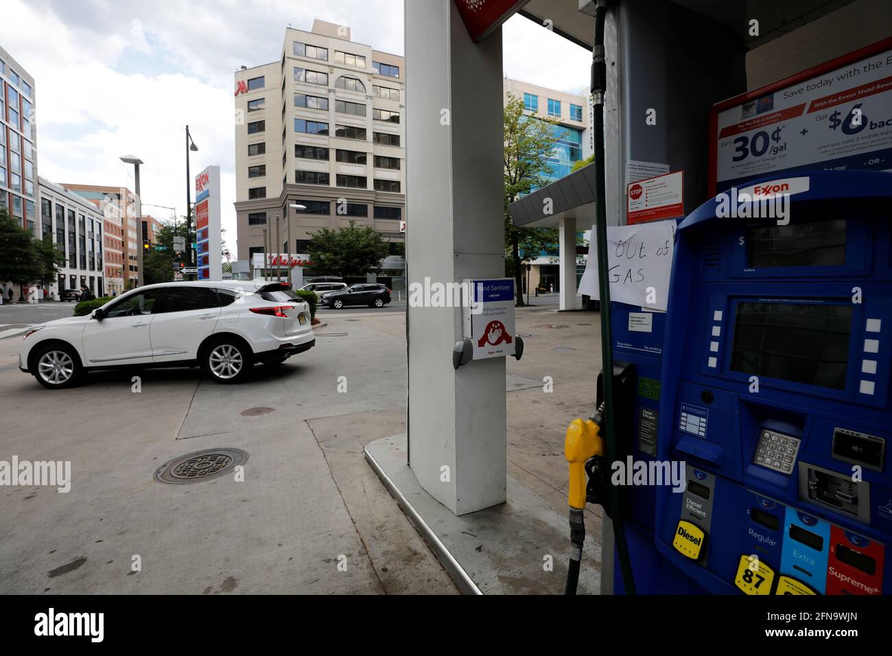A man drives through an Exxon station which is out of gas after a cyberattack crippled the biggest fuel pipeline in the country, run by Colonial Pipeline, in Washington, U.S., May 15, 2021. REUTERS/Yuri Gripas Stock Photo