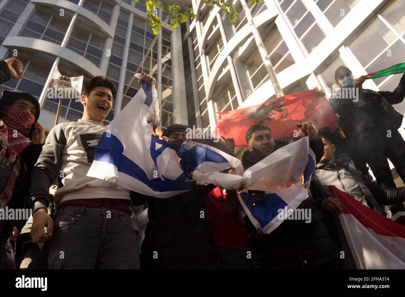 London, UK. May 15 2021: Protesters burn the flag of Israel. SebastianGarraway/ AlamyLiveNews Credit: Sebastian Garraway/Alamy Live News Stock Photo