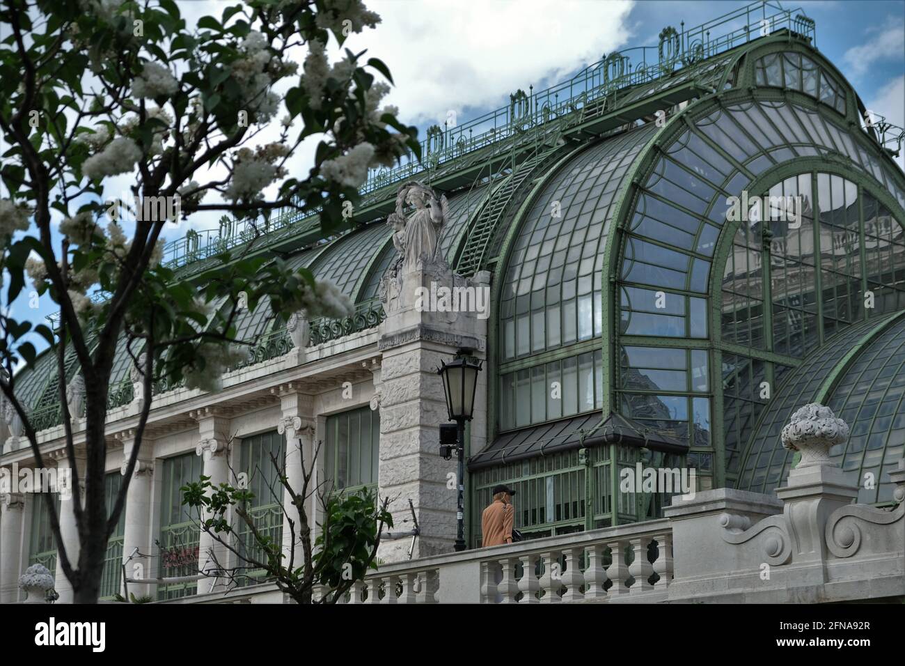 The Art Nouveau Imperial Butterfly House in Vienna, Austria. A woman