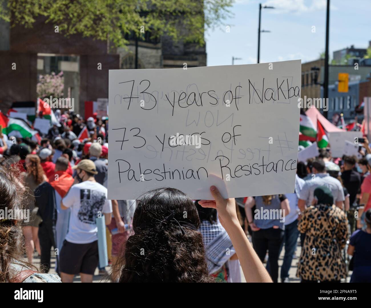 Ottawa, Canada. May 15th, 2021. On the Nakba day, commemorating the 1948 Palestinian forced Exodus from Palestinian territories, thousands of protesters gather and march through the street of Ottawa to demand that Palestine be freed from Israel occupation. The also denounce the increase of violence from the Israeli army over the last week, and demand that the Canadian government speak up about the attacks of Palestinians in Gaza, Jerusalem, West bank and all of Palestine. Credit: meanderingemu/Alamy Live News Stock Photo