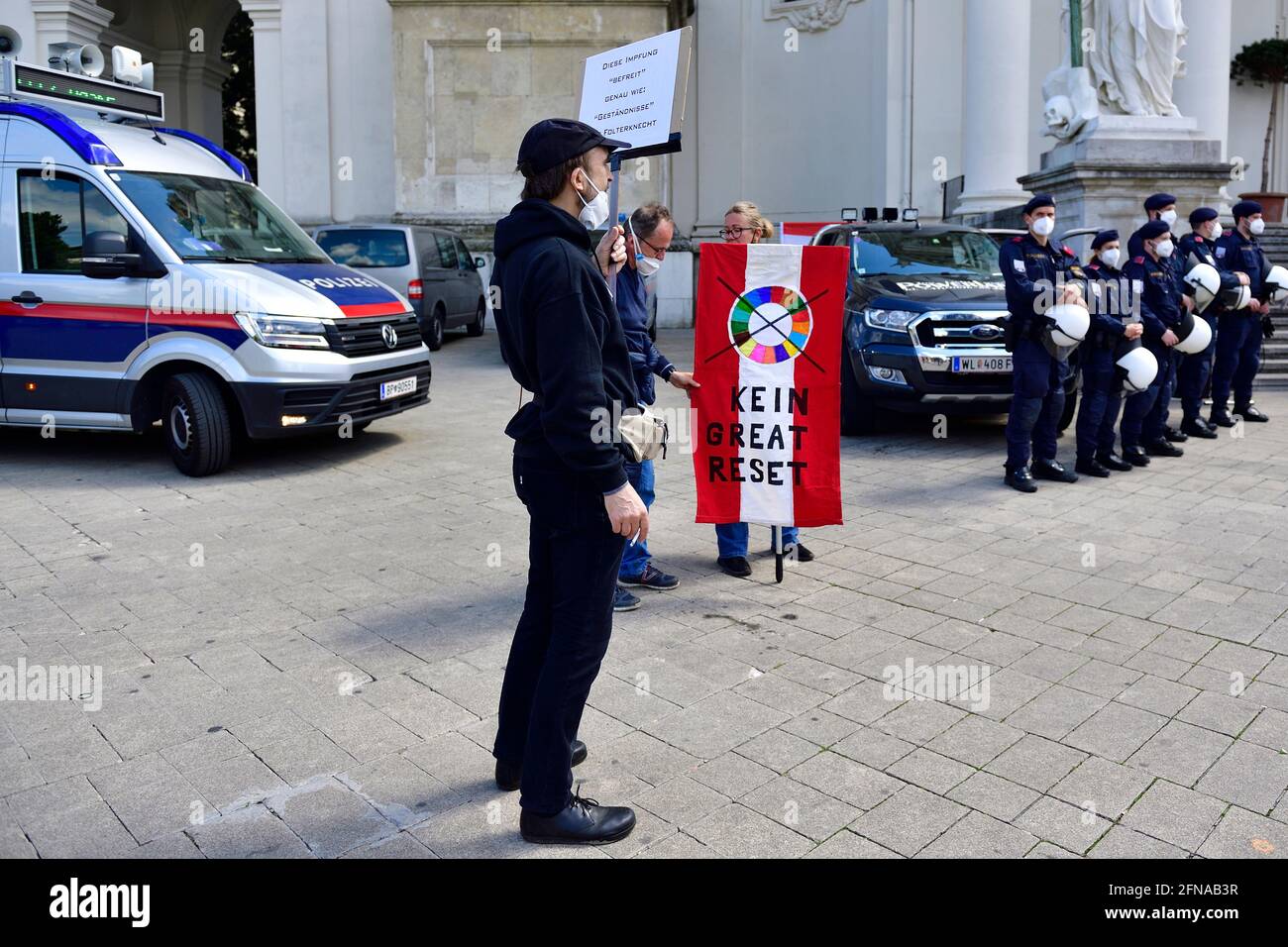 Vienna, Austria. 15th May, 2021. 40 meetings have been registered for today, including rallies against CoV measures. An unapproved anti-corona and anti-government demonstration  in Vienna in the city center. Flag with the inscription 'No Great Reset'. Stock Photo