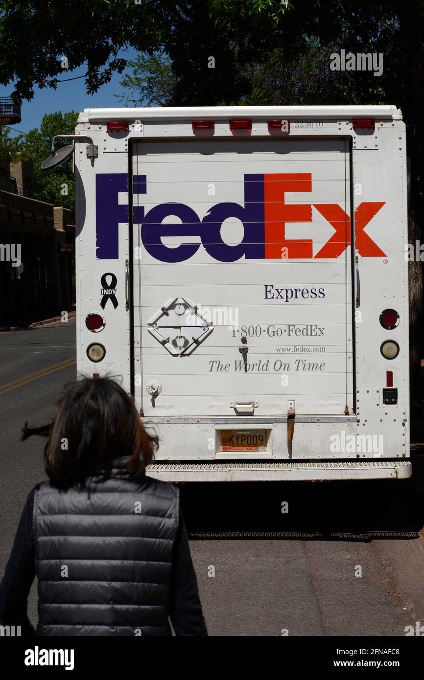 A FedEx (Federal Express) truck makes deliveries in Santa Fe, New Mexico. Stock Photo