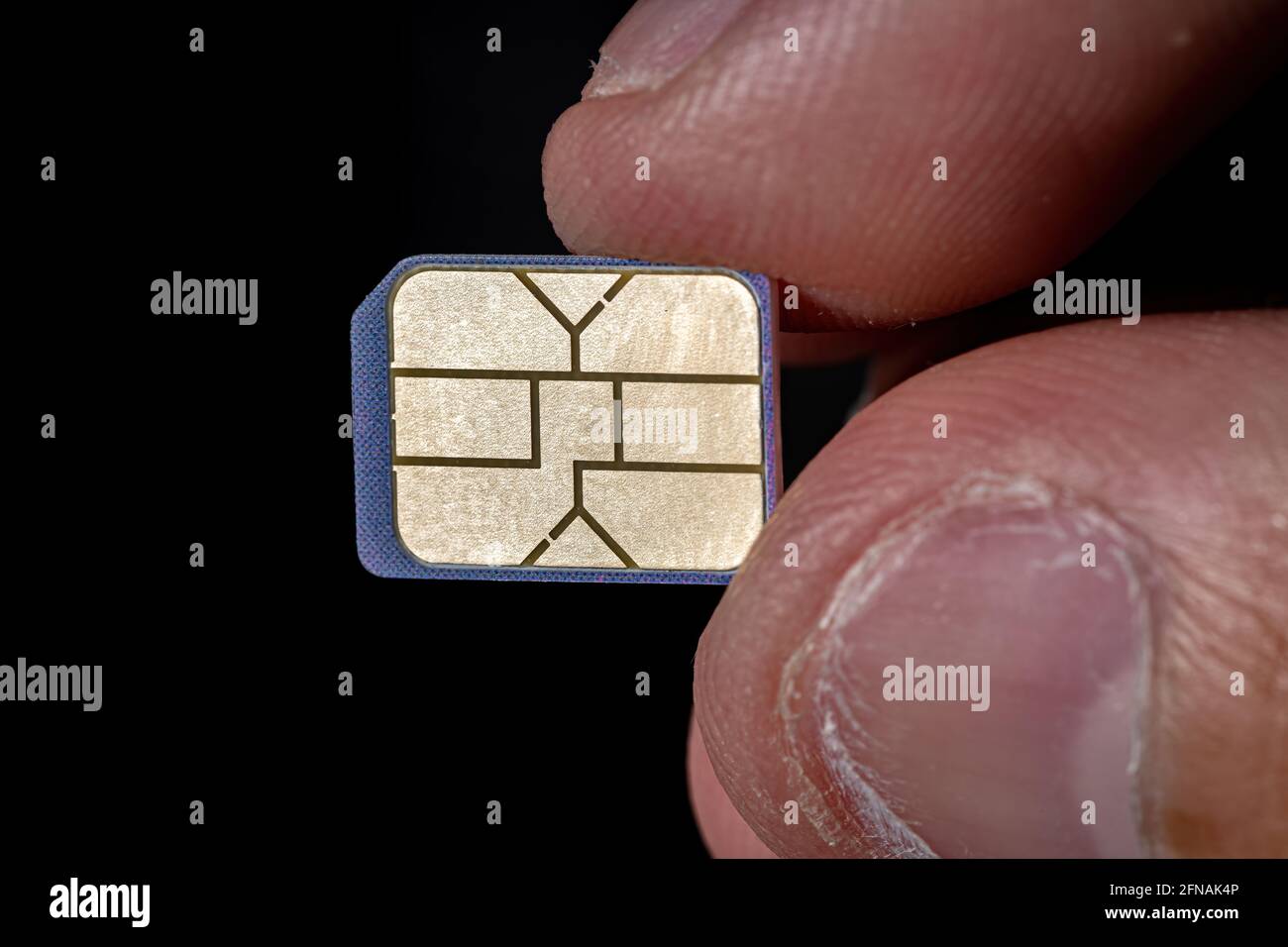 Mobile phone SIM card in one hand Stock Photo Alamy