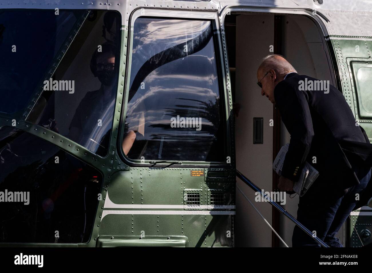Washington, United States. 15th May, 2021. U.S. President Joe Biden boards Marine One behind First Lady Jill Biden on the Ellipse near the White House in Washington, DC, U.S., on Saturday, May 15, 2021. Biden rescinded several executive actions on Friday that were put in place by Donald Trump, including one targeting social media companies that his predecessor had ordered after Twitter fact-checked his tweets. Photographer: Samuel Corum/Pool/Sipa USA Credit: Sipa USA/Alamy Live News Stock Photo