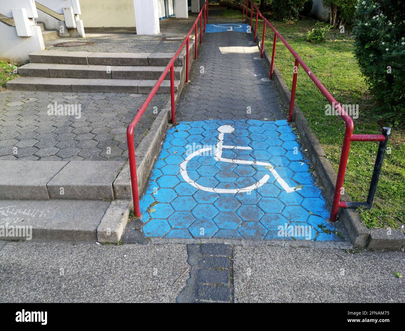 Painted disable parking sign on the asphalt Stock Photo - Alamy