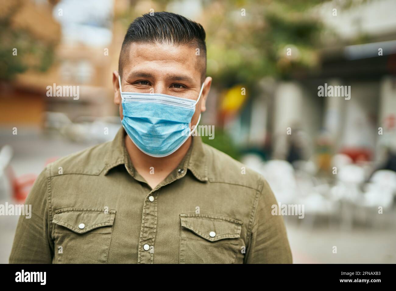 Latin young man mask walking hi-res stock photography and images - Alamy