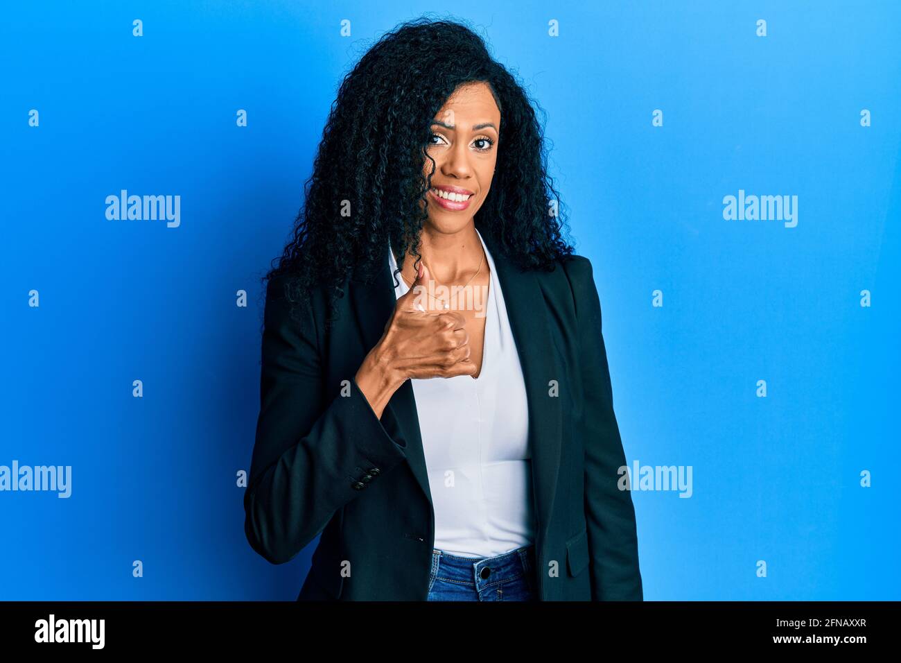 Middle age african american woman wearing business clothes doing happy ...