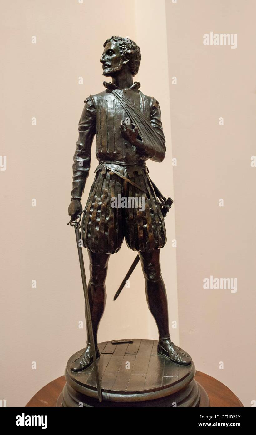 Miguel de Cervantes Saavedra statuette, depicted as Battle of Lepanto soldier. By Sergio Blanco, 1999. Museo Naval de Stock Photo
