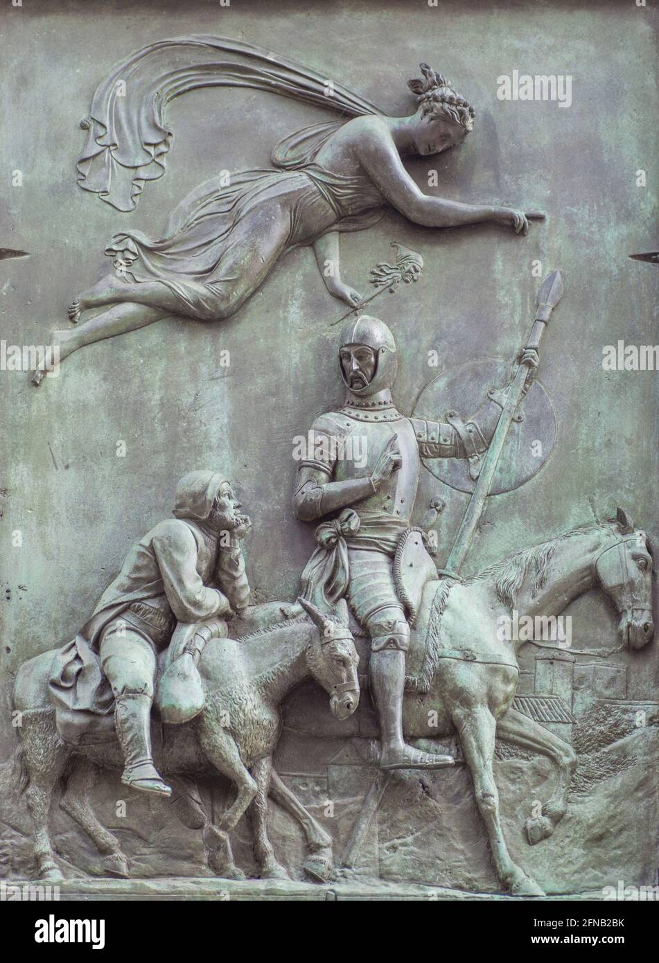 Bronze reliefs with Don Quixote scene. By Jose Piquer Duart, 1835. Don Quixote and Sancho Panza driven by the goddess of The Madness Stock Photo