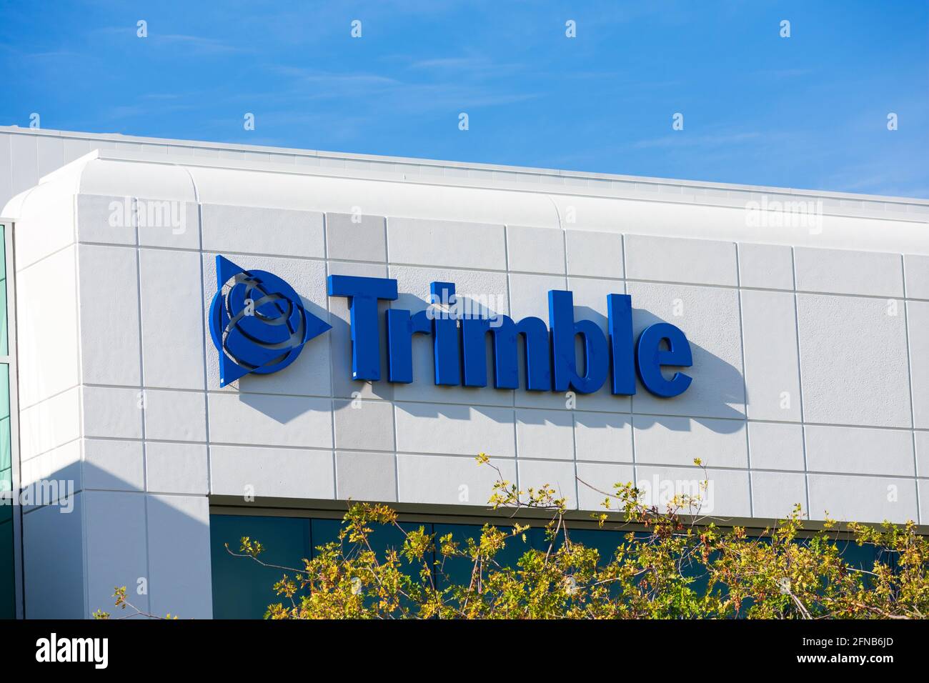 Trimble Inc. headquarters exterior. Trimble develops positioning technology solutions for surveying, construction, agriculture, public safety and mapp Stock Photo