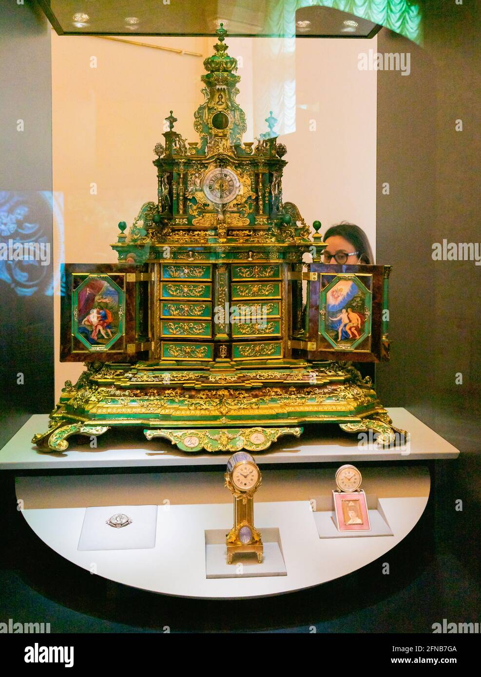 Cabinet with a clock by Cartier made in Germany in 1700s, at the exhibition Stock Photo