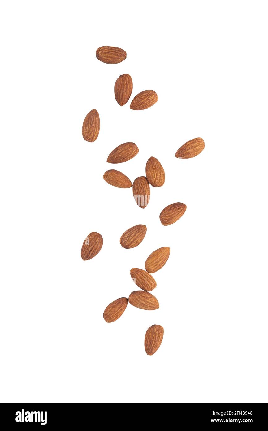 Almonds falling isolated on white background with clipping path. Stock Photo