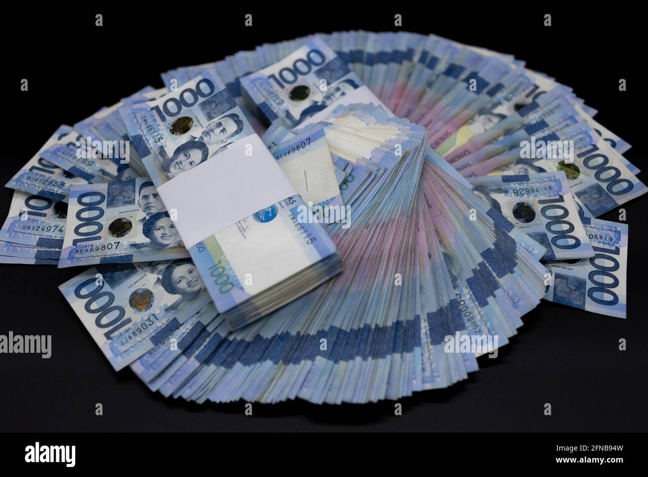 A Pile of One Thousand Philippines Peso Banknotes. Cash of