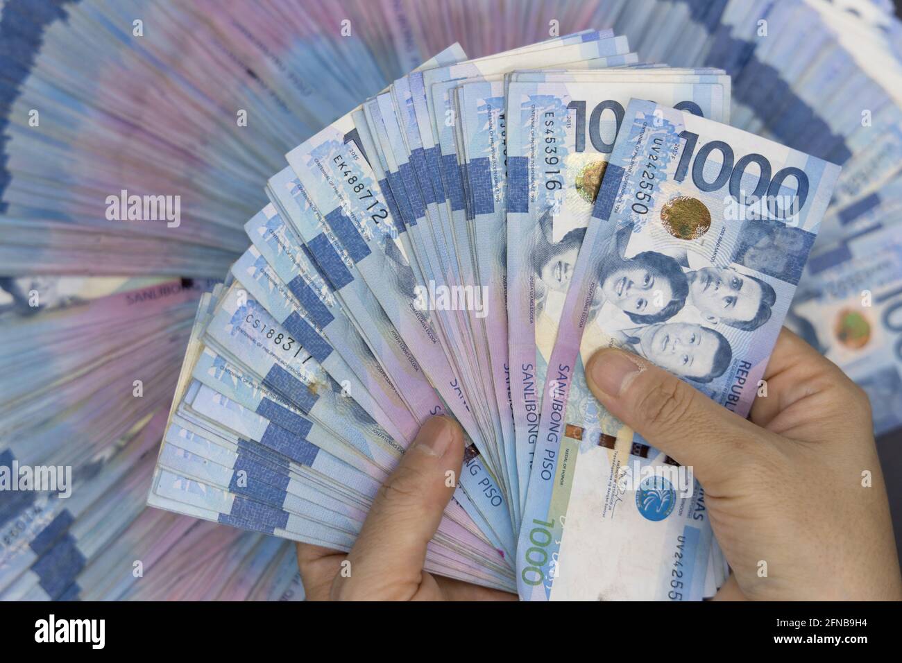A pile of one thousand Philippines banknotes. Cash of Thousand dollar