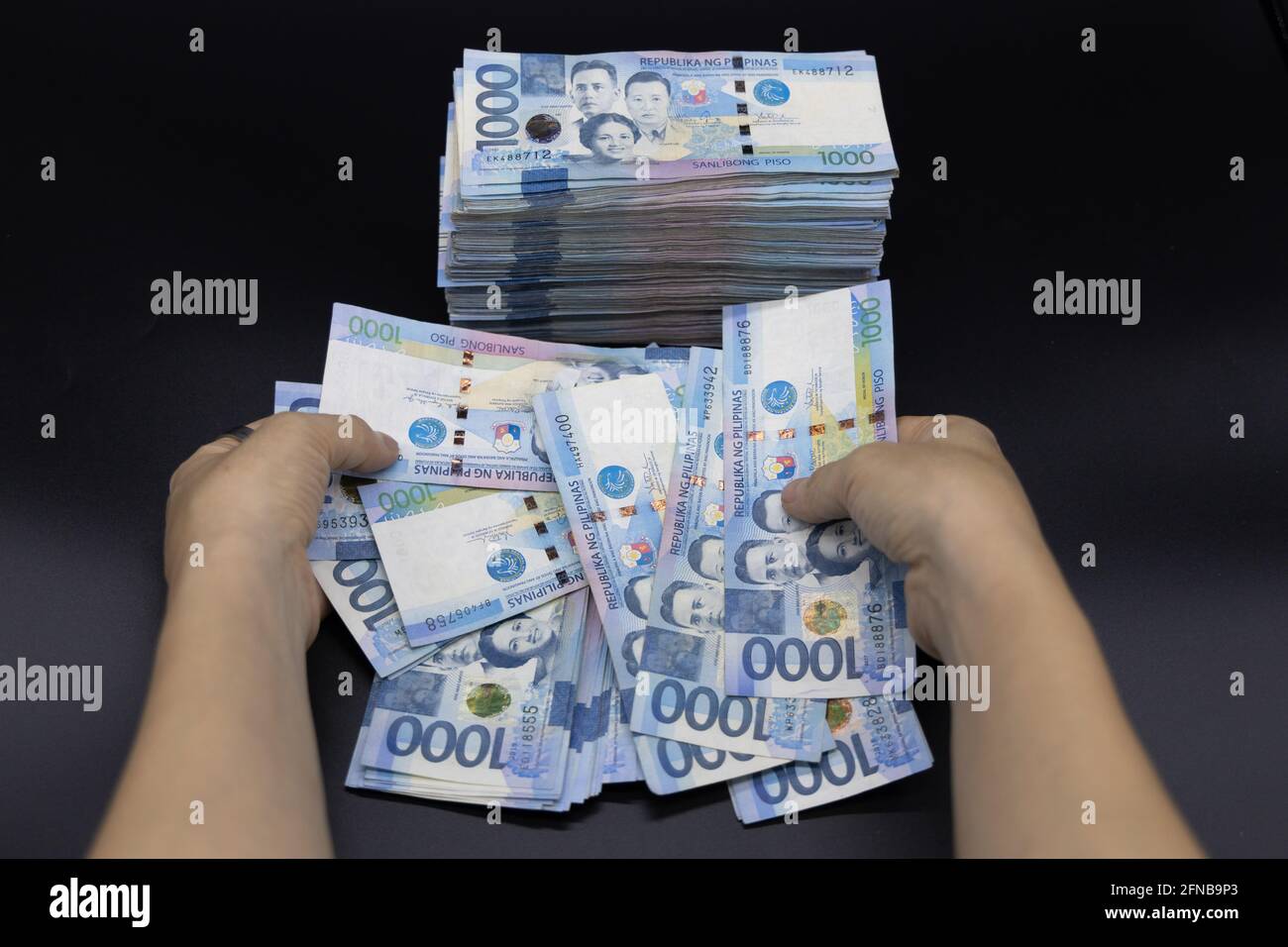 A Pile Of One Thousand Philippines Banknotes. Cash Of Thousand