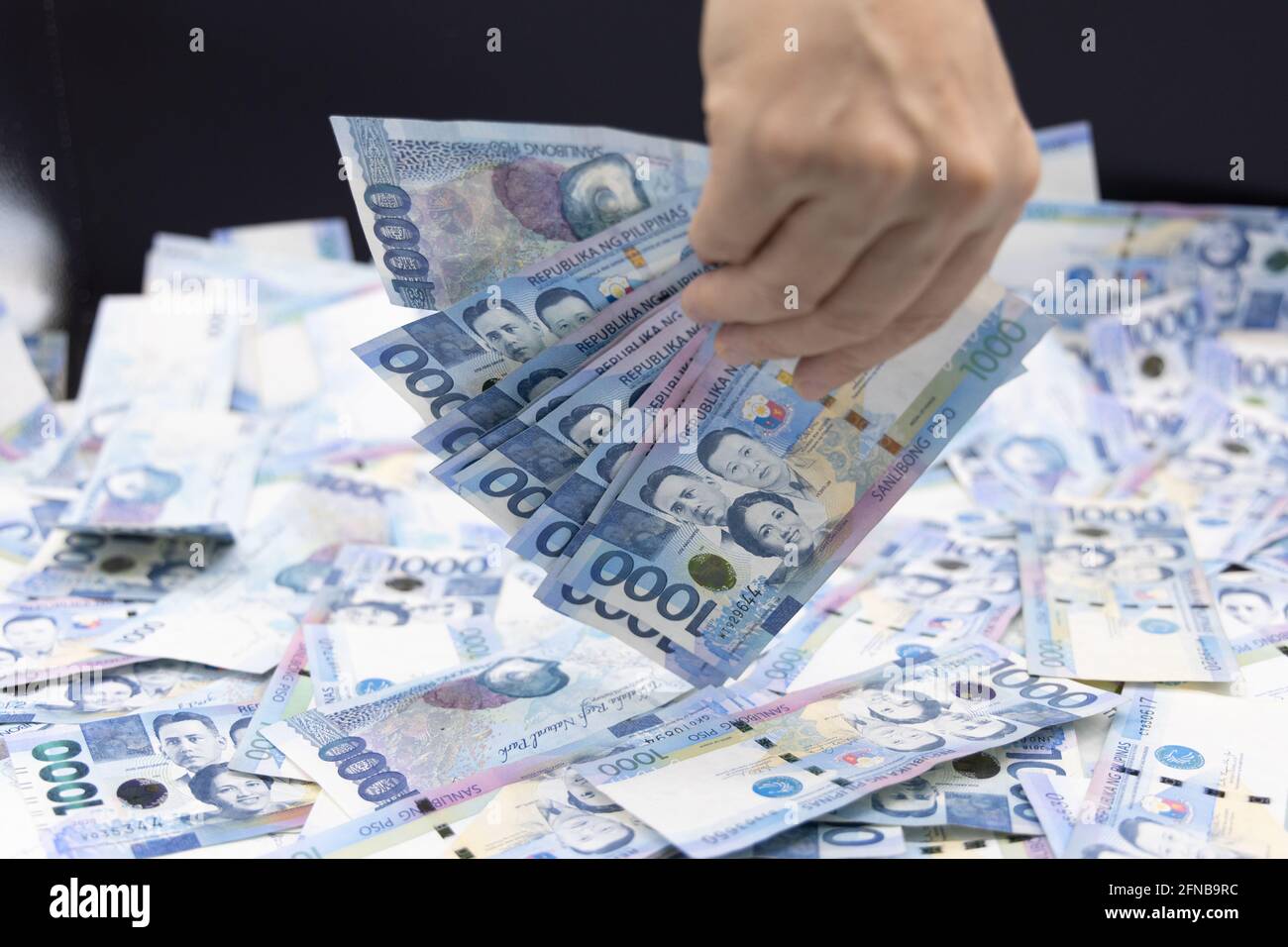 A Pile Of One Thousand Philippines Banknotes. Cash Of Thousand