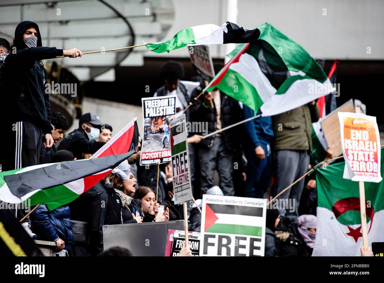 London, UK. 15th May, 2021. Protesters hold Palestinian flags and placards at the Israeli Embassy in London, in solidarity with Palestine as many Israeli cities are in conflict between Jewish and Arab people. Credit: SOPA Images Limited/Alamy Live News Stock Photo