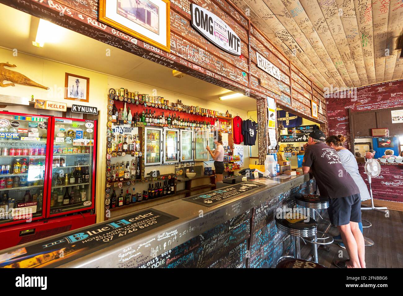 Bar counter of the iconic Blue Heeler Hotel with its writings on the walls and ceiling, Kynuna, Queensland, QLD, Australia. Stock Photo