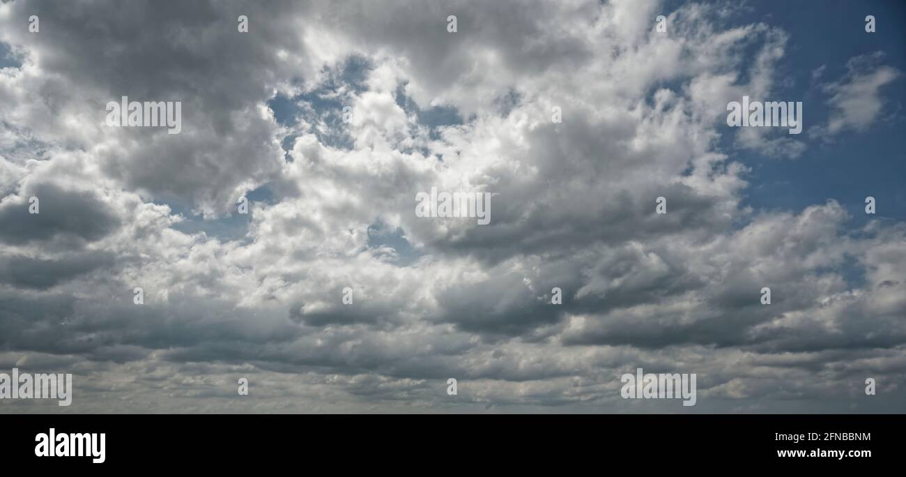 A group of clouds in the sky at sunny afternoon Stock Photo Alamy