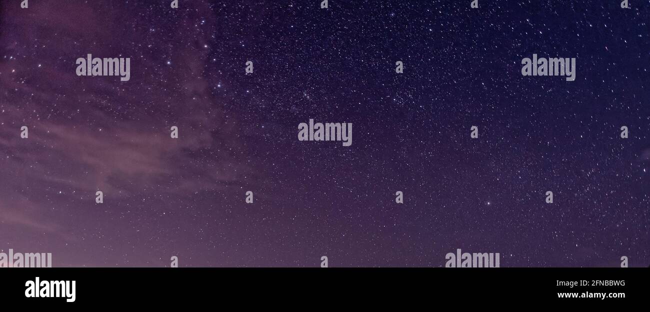 Purple night sky full of stars as background Stock Photo - Alamy
