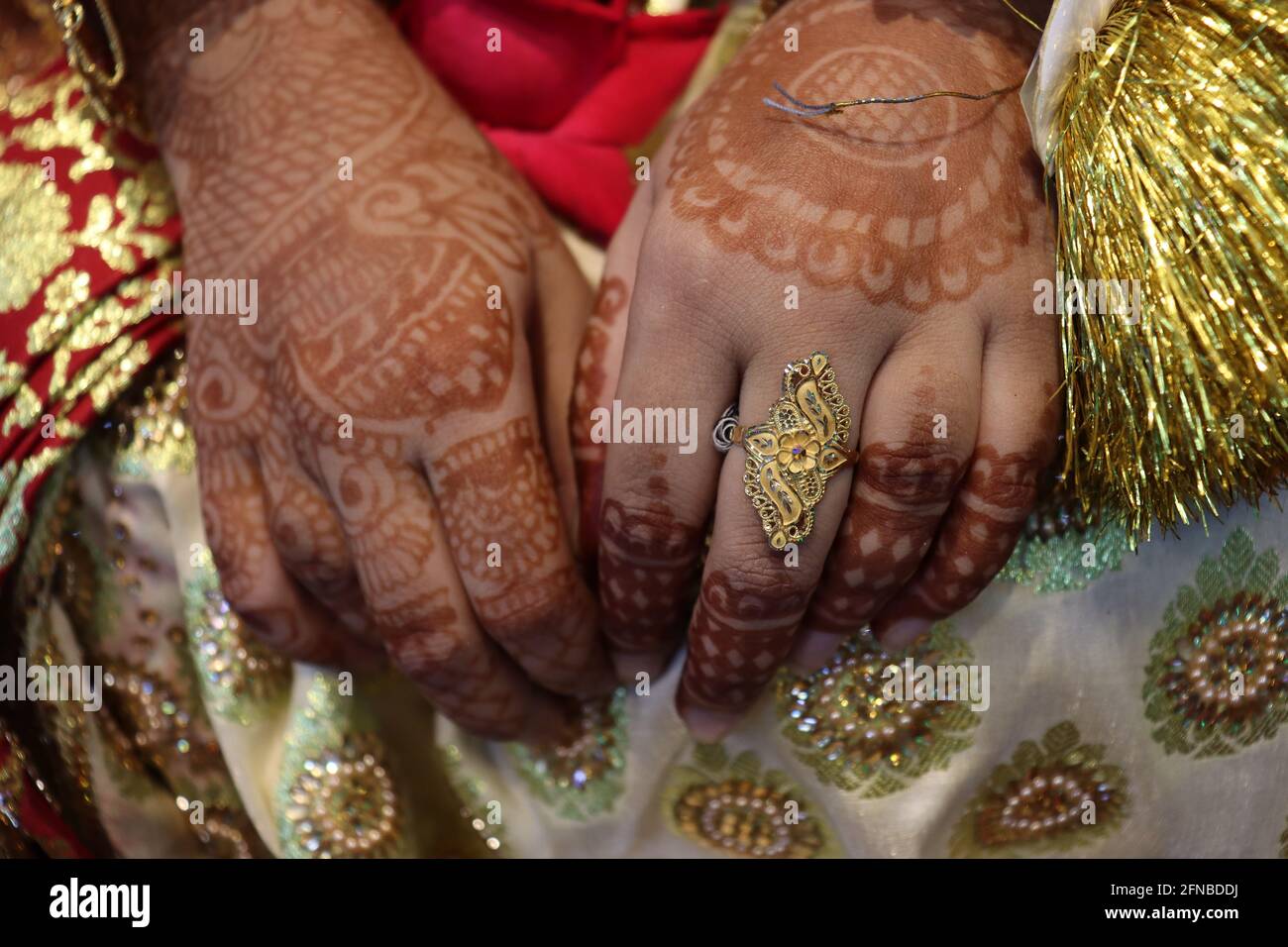a Bangladeshi bride closeup with wedding ring in finger Stock Photo