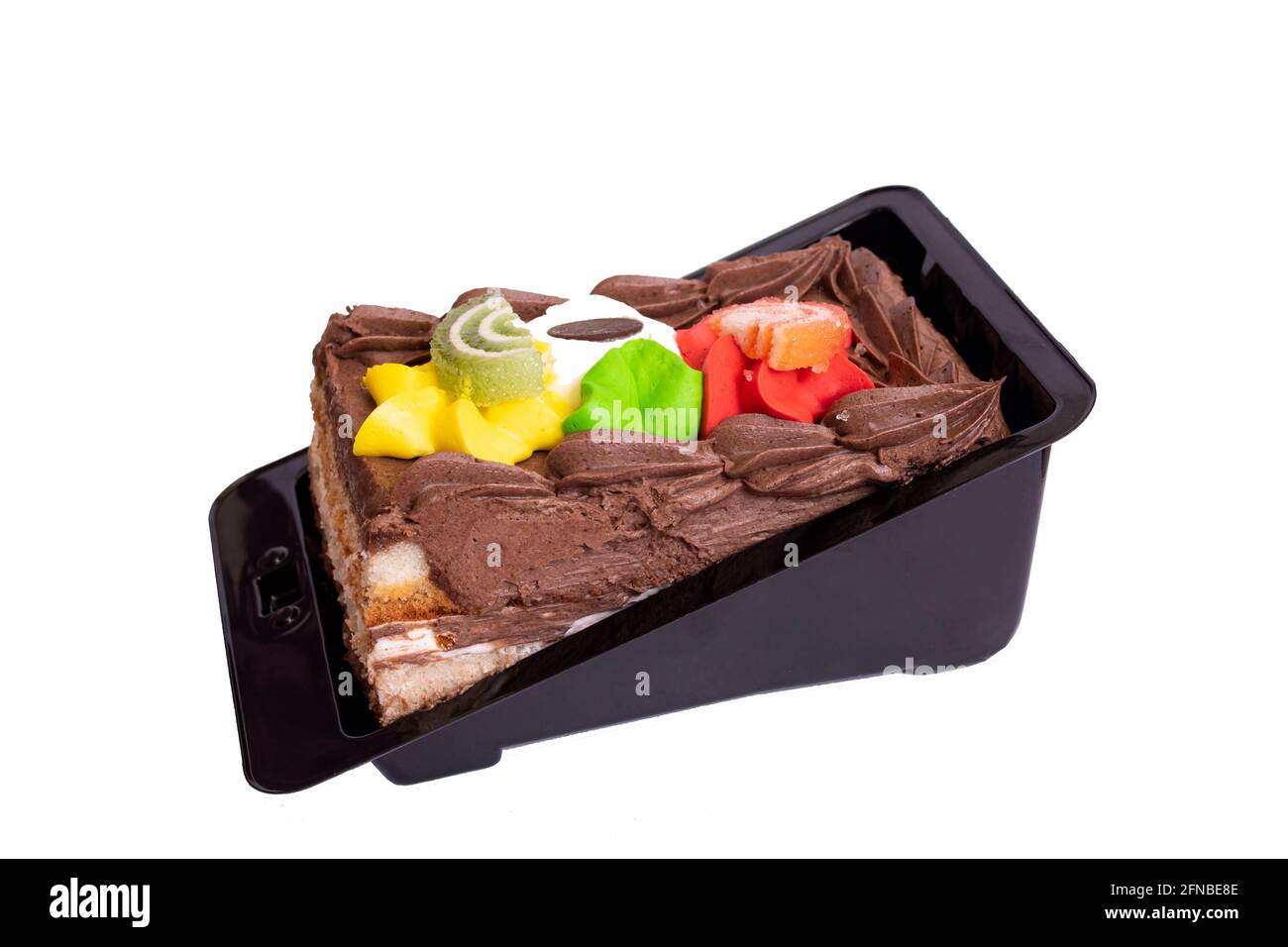 Chocolate cream cake isolated on white background close up Stock Photo