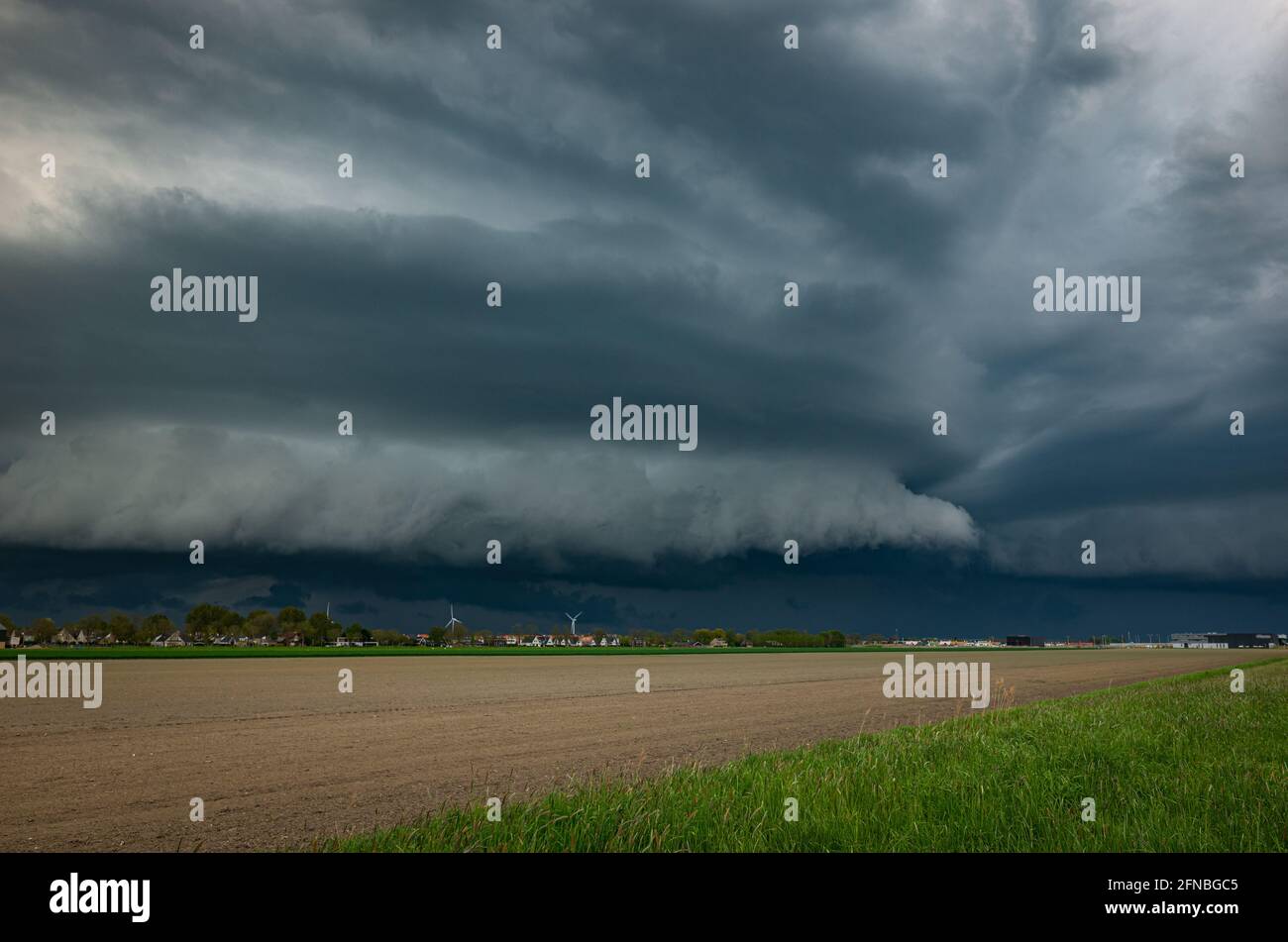 Upcoming shelf cloud of a strong thunderstorm over the Dutch plains Stock Photo