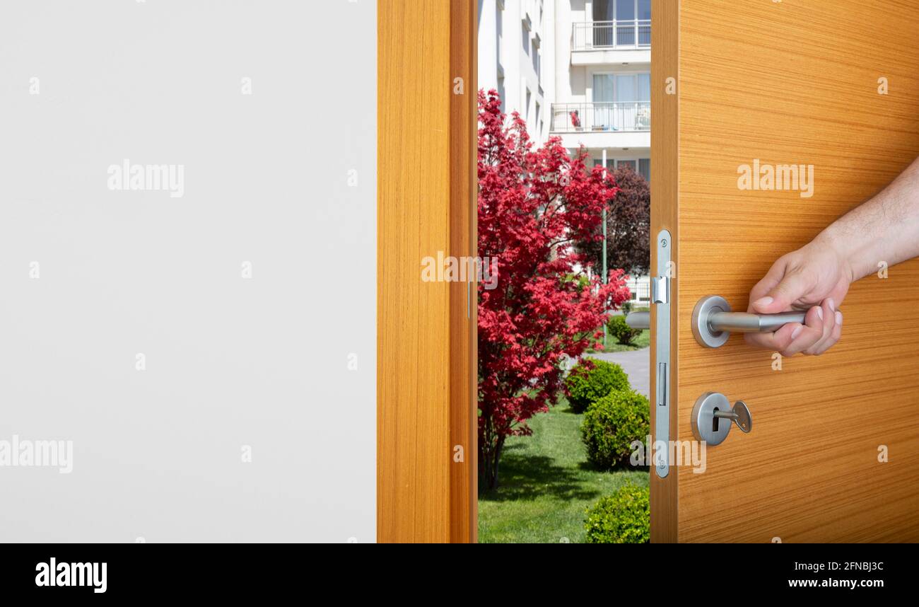 the man's hand opening the door. Front view Stock Photo