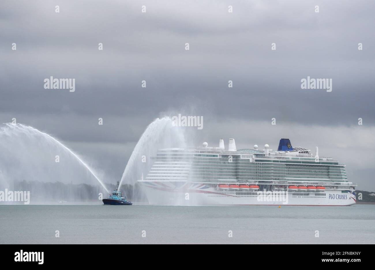 Southampton, Hampshire, UK. 16th May 2021. New P&O cruise ship Iona sails into Southampton. At 344 metres long, Iona is Britain’s largest cruise ship and will be named in Southampton Docks later today. The naming ceremony which will feature a performance by music star Gary Barlow is being held as a virtual event, with VIP guests watching the ceremony remotely. Credit Stuart Martin/Alamy Live News Stock Photo