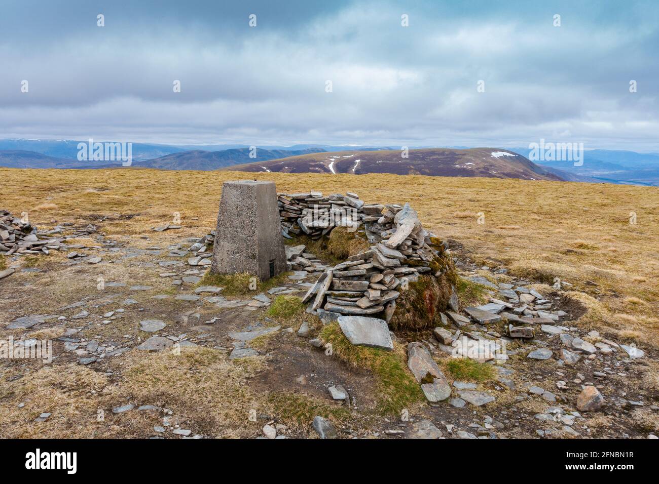 The summit cairn of the Munro Mountain of Sgairneach Mhor to the west of the Drumochter pass, Scotland Stock Photo