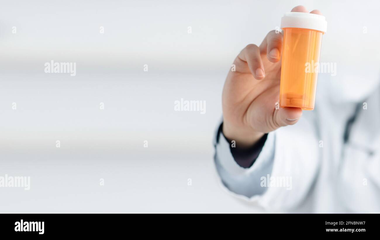 Doctor recommends taking medicine, vitamins, food supplement. Prescribing drug Stock Photo