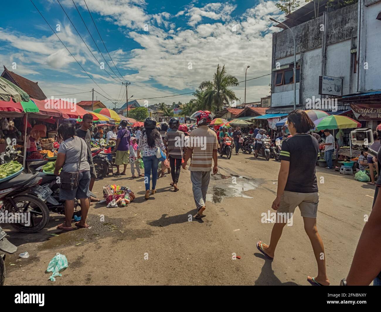 Ambon., Indonesia - Feb, 2018: Crowd of the local people selling and buying different goods on the market, Island of Ambon, Maluku, Indonesia. Asia Stock Photo