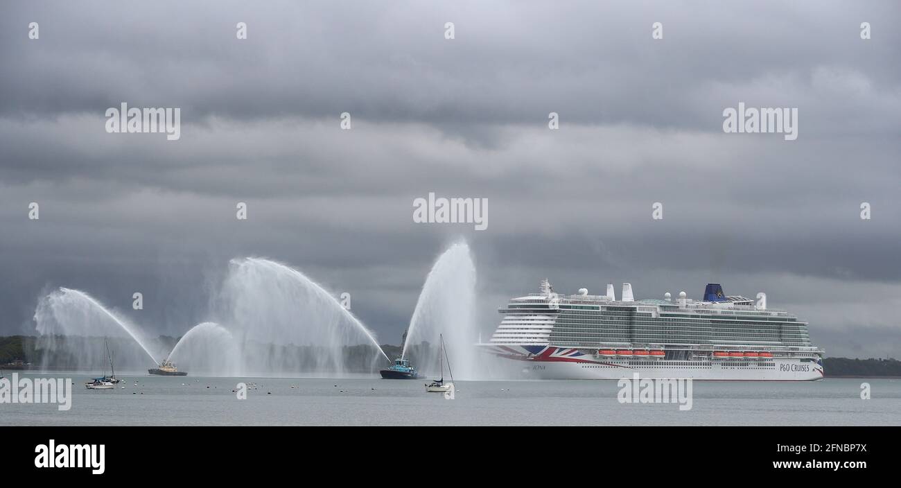 Southampton, Hampshire, UK. 16th May 2021. New P&O cruise ship Iona sails into Southampton. At 344 metres long, Iona is Britain’s largest cruise ship and will be named in Southampton Docks later today. The naming ceremony which will feature a performance by music star Gary Barlow is being held as a virtual event, with VIP guests watching the ceremony remotely. Credit Stuart Martin/Alamy Live News Stock Photo