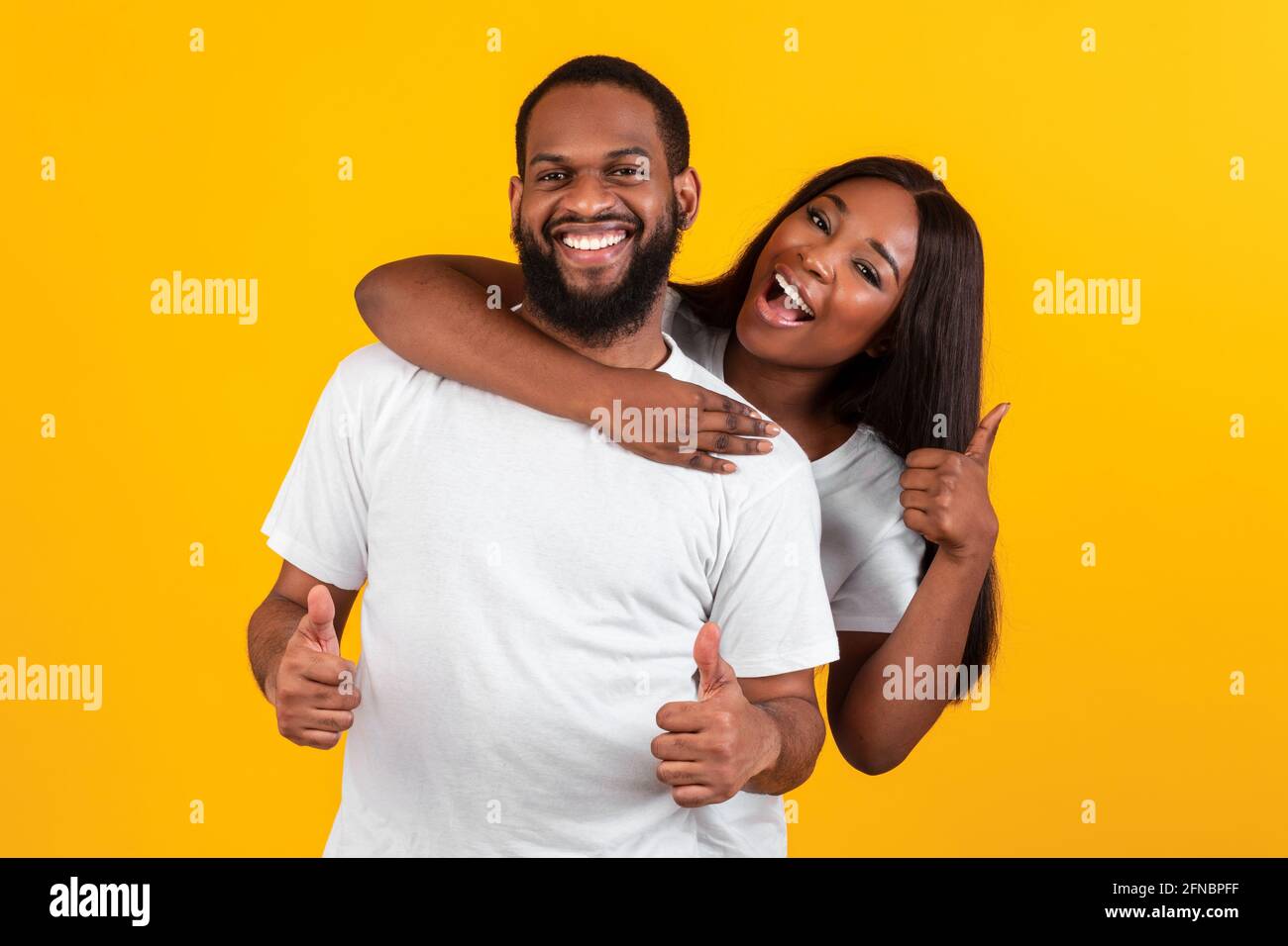 Smiling winner family hugging hi-res stock photography and images - Alamy