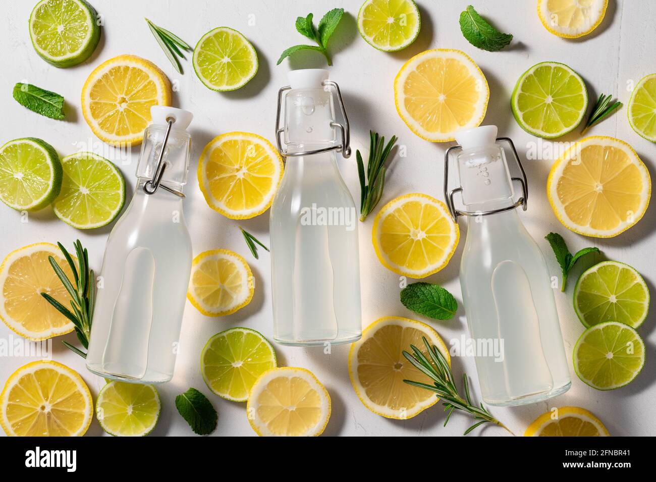three glass bottles of lemonade on tropical background Stock Photo Alamy