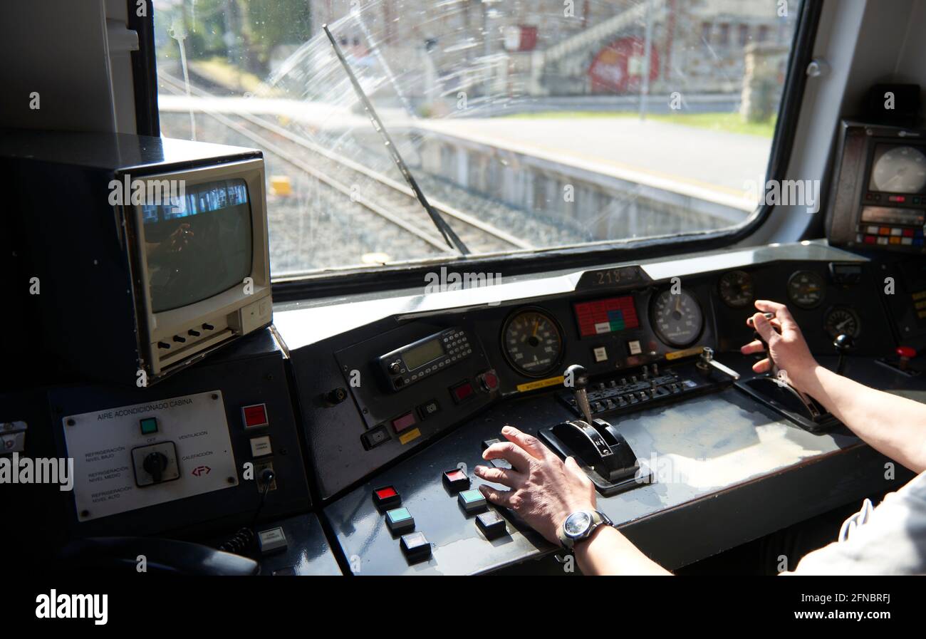 Interior view of the pilot hands and instrument panel cockpit of ancient train Stock Photo