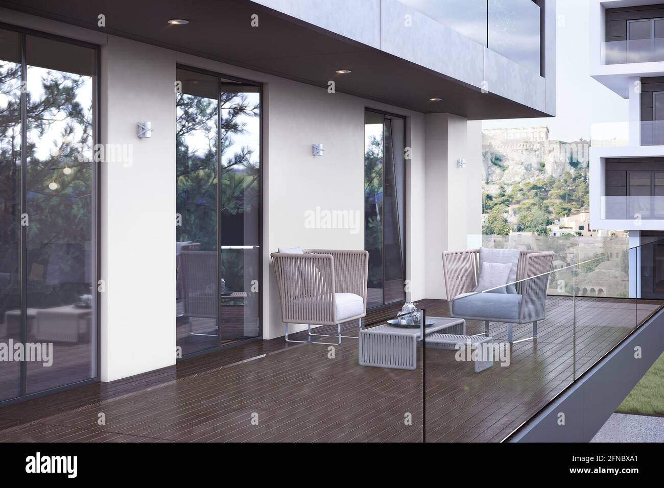 Athens Greece – June 15 2018: balcony in a modern apartment with furniture,  flowers and city views Stock Photo - Alamy