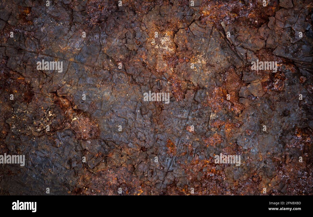 Close up of flaking rust on a piece of steel sheet. Mineralisation. Compositing texture, grunge, rust, weathering, aged, vintage. Background. Stock Photo