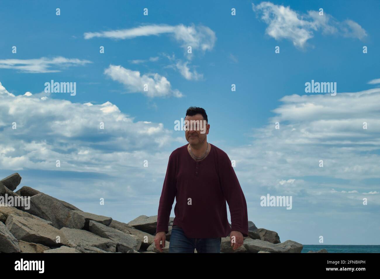 Lonely man at beach hi-res stock photography and images - Alamy