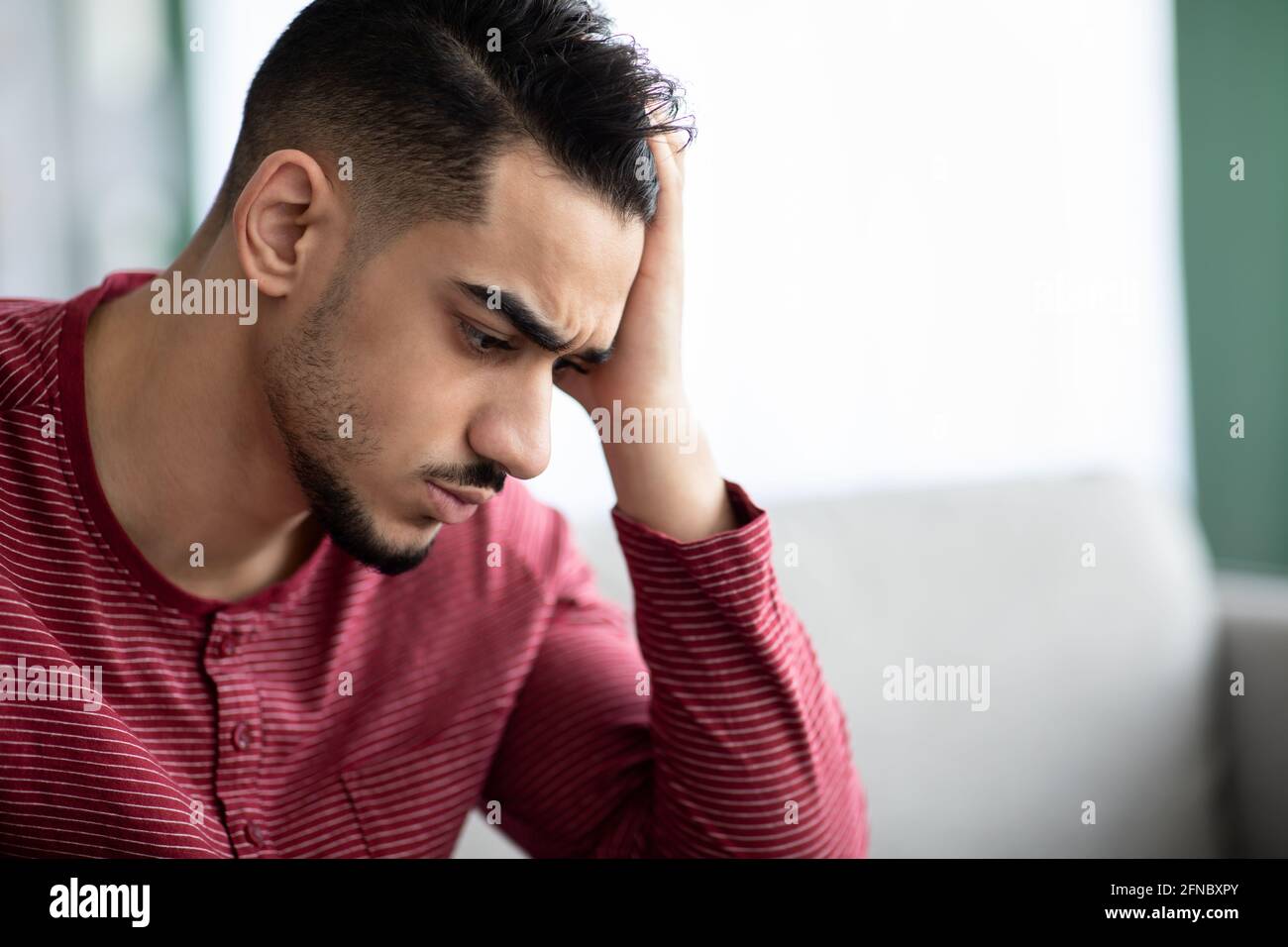 Closeup portrait of upset arab guy having difficulties Stock Photo
