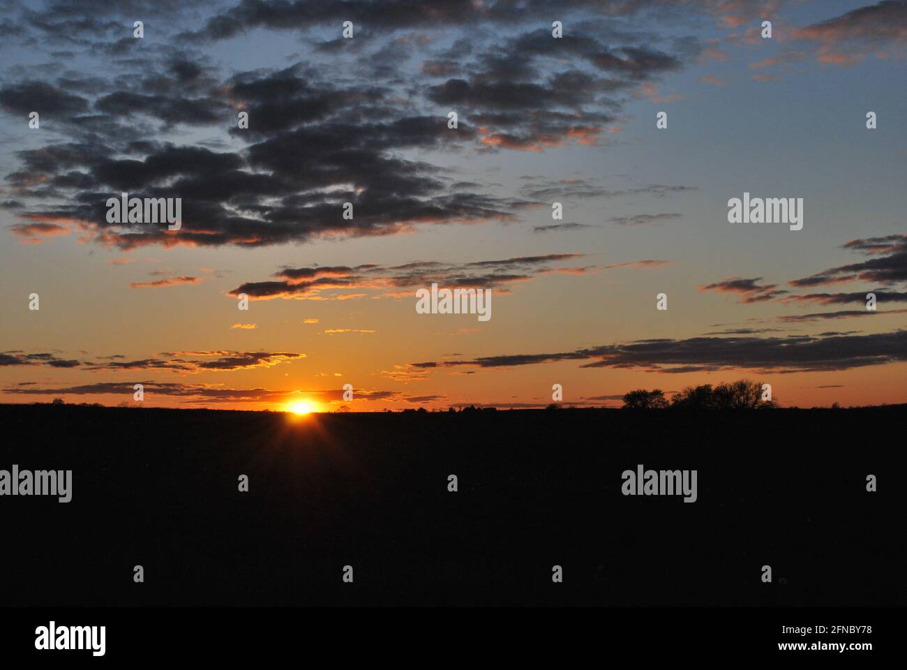 Sunset on horizon Stock Photo