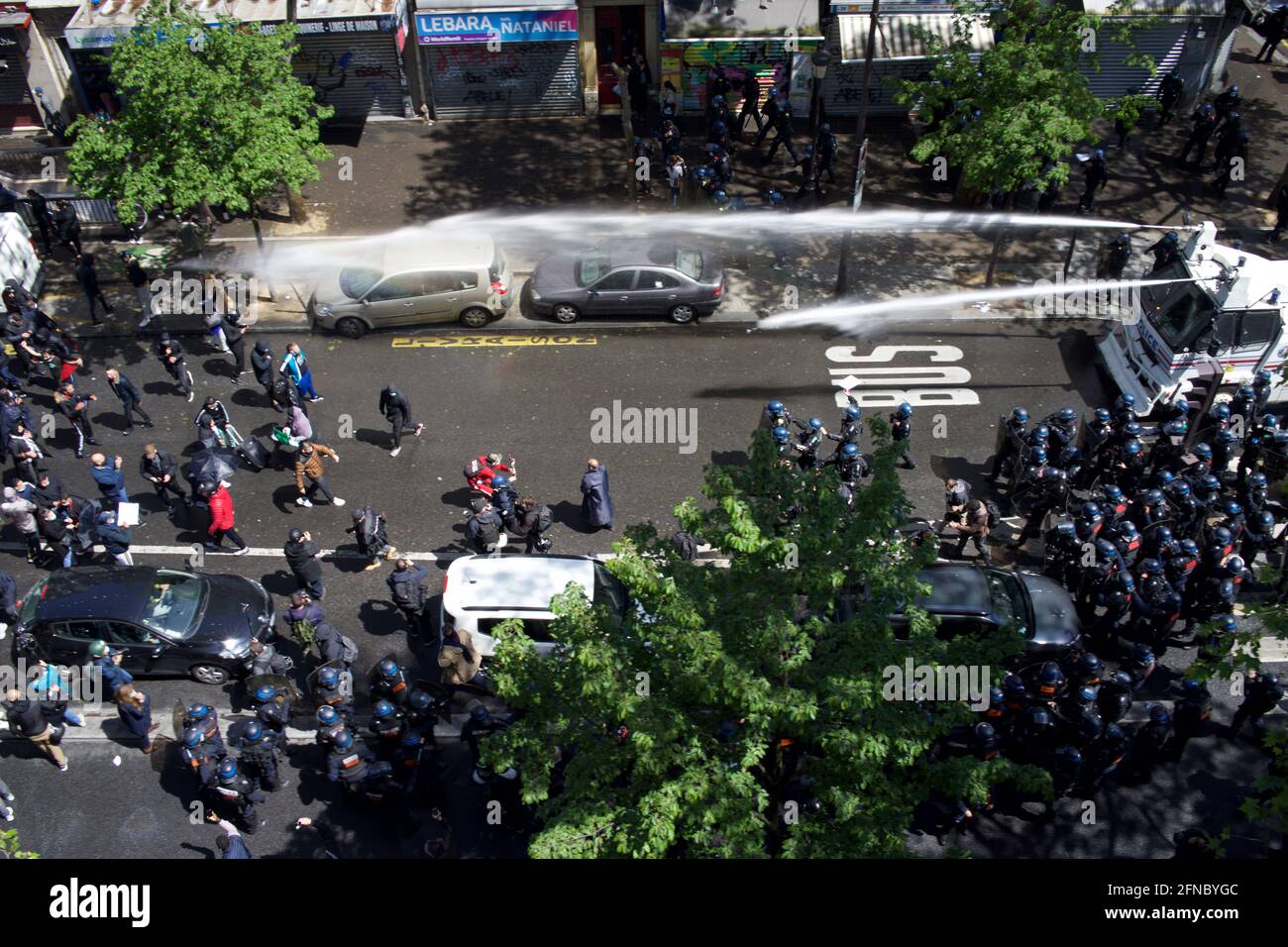 Police fire water cannons to disperse Palestine supporters gathered at Pro-Palestinian demonstration, Boulevard Barbès, Paris, France, May 15th, 2021 Stock Photo