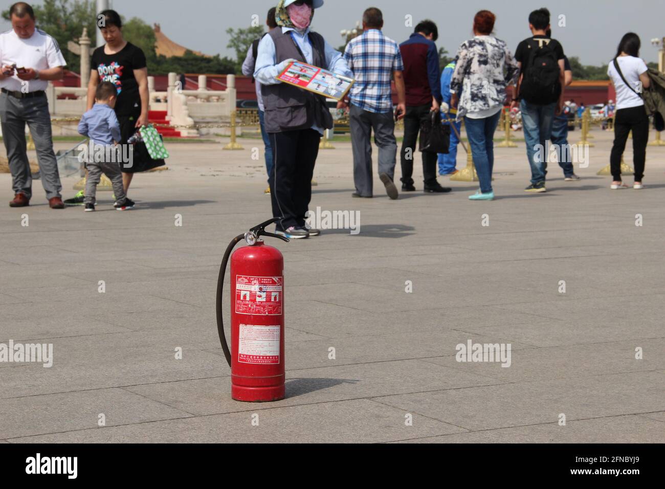 LONDON, UK - MAY 8 2016: Fire extinguisher sits in Tiananmen Square in cash of a self-immolation protest Stock Photo