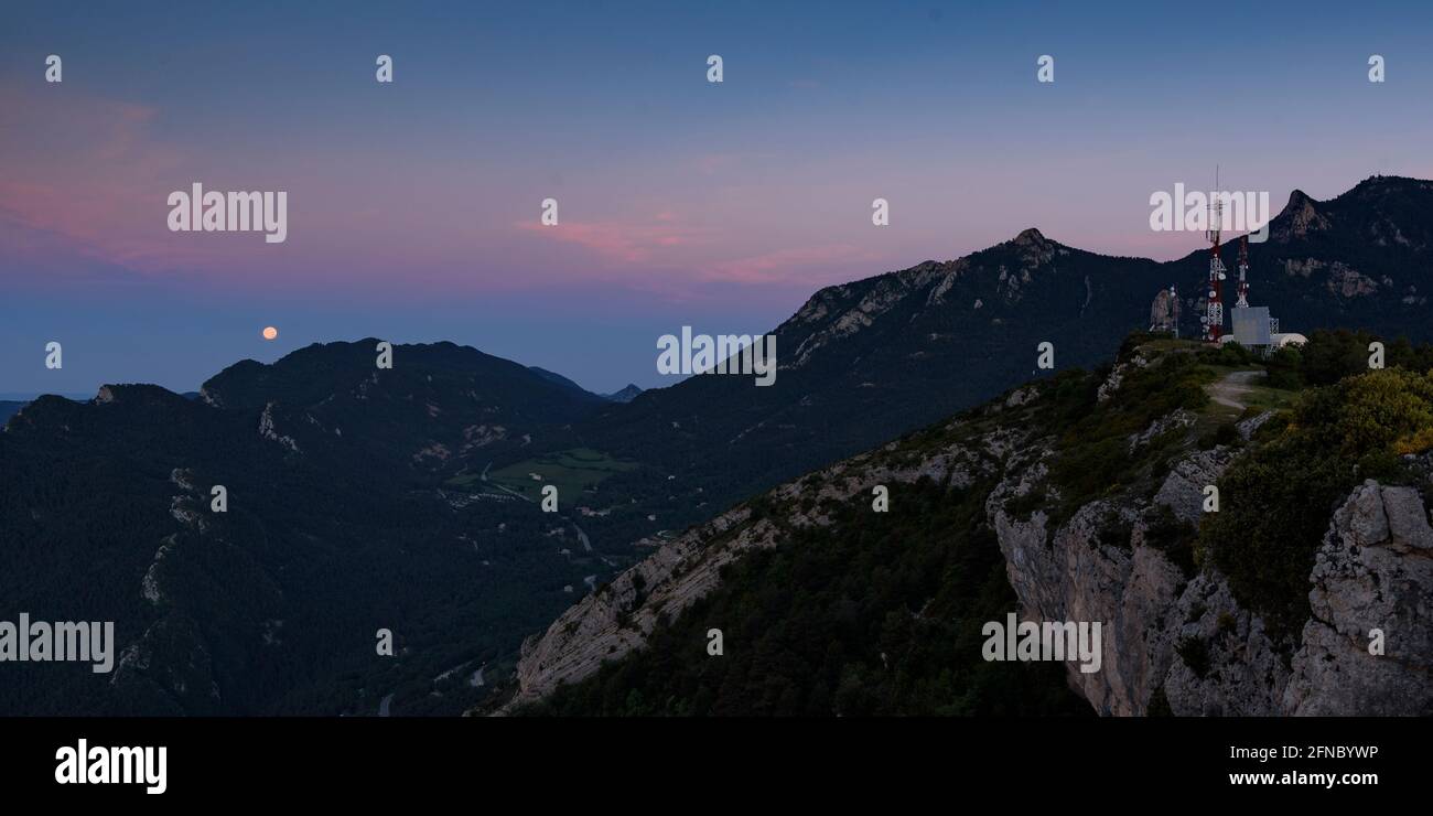 Sunrise and moonset from the Figuerassa viewpoint, in a summer morning (Barcelona province, Catalonia, Spain, Pyrenees) Stock Photo