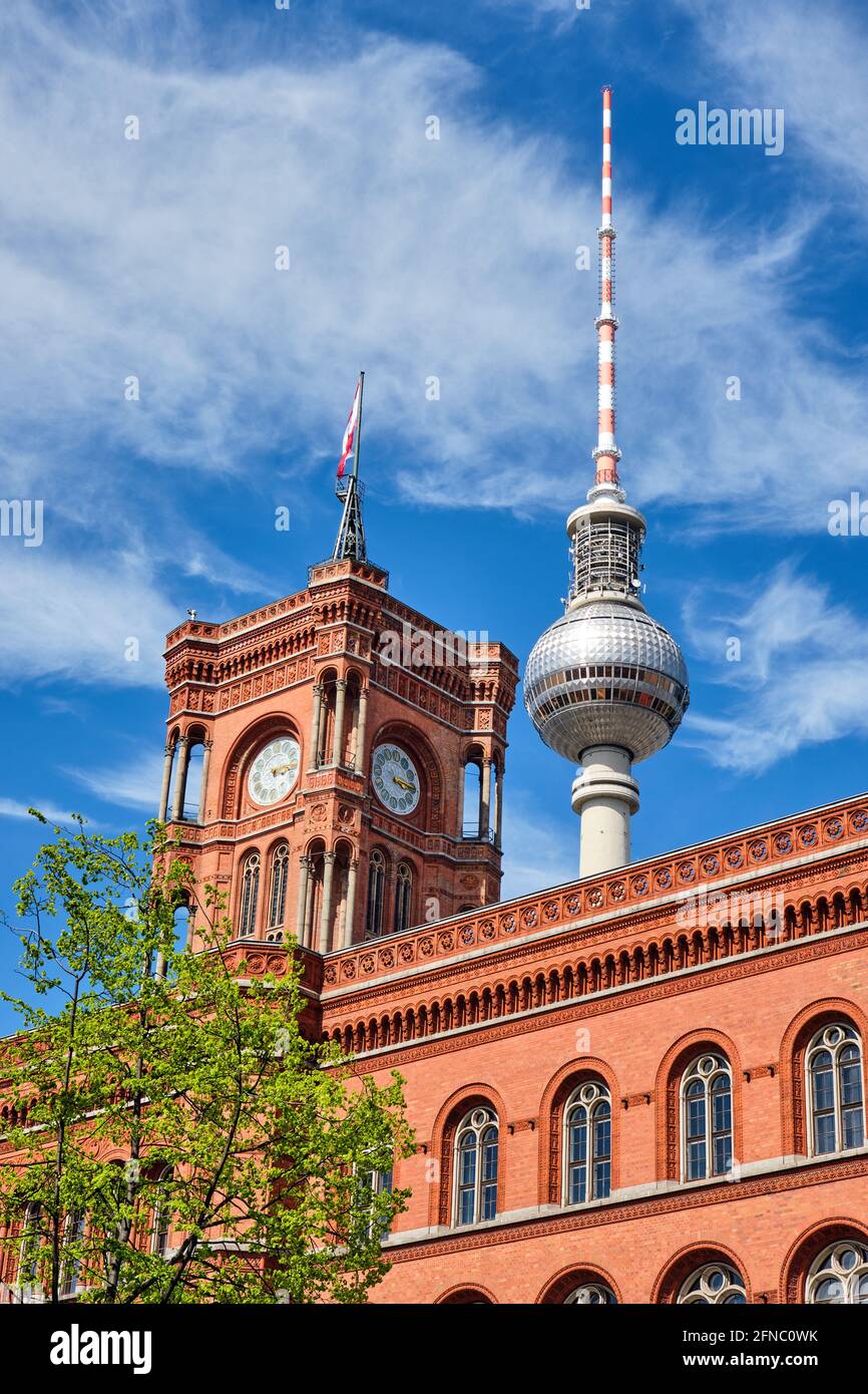 The famous Television Tower and the tower of the city hall in Berlin Stock Photo