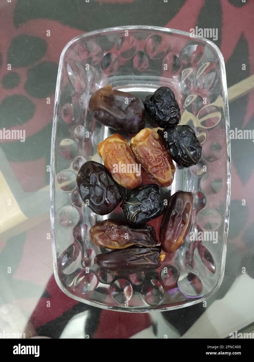 Phoenix dactylifera, commonly known as date or date palm, is a flowering plant species in the palm family Stock Photo