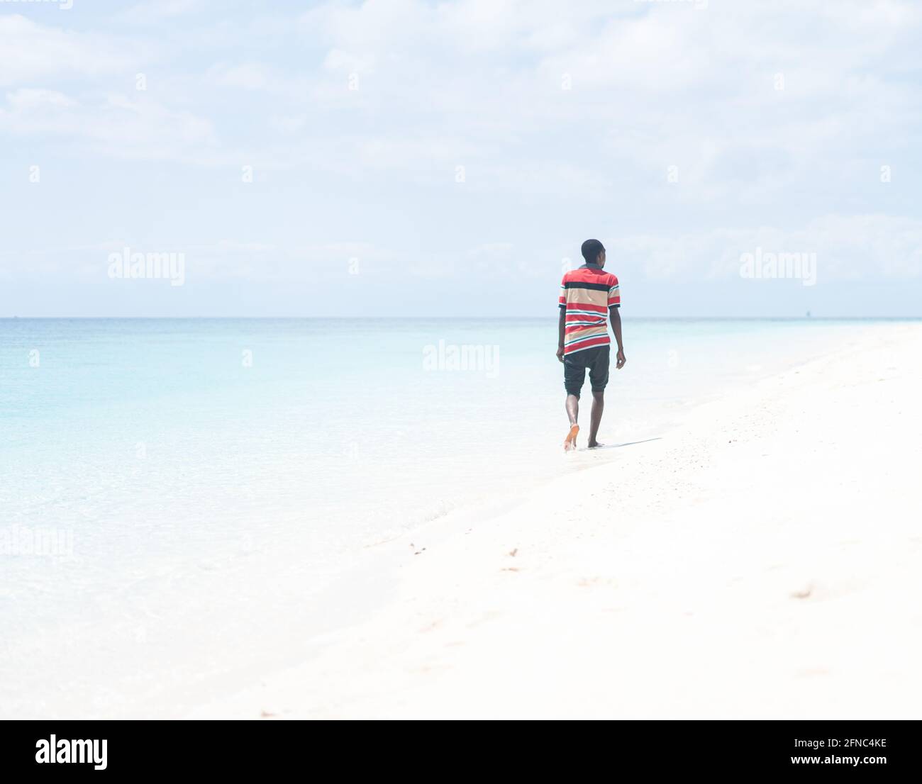 Back black man walking outside hi-res stock photography and images - Alamy