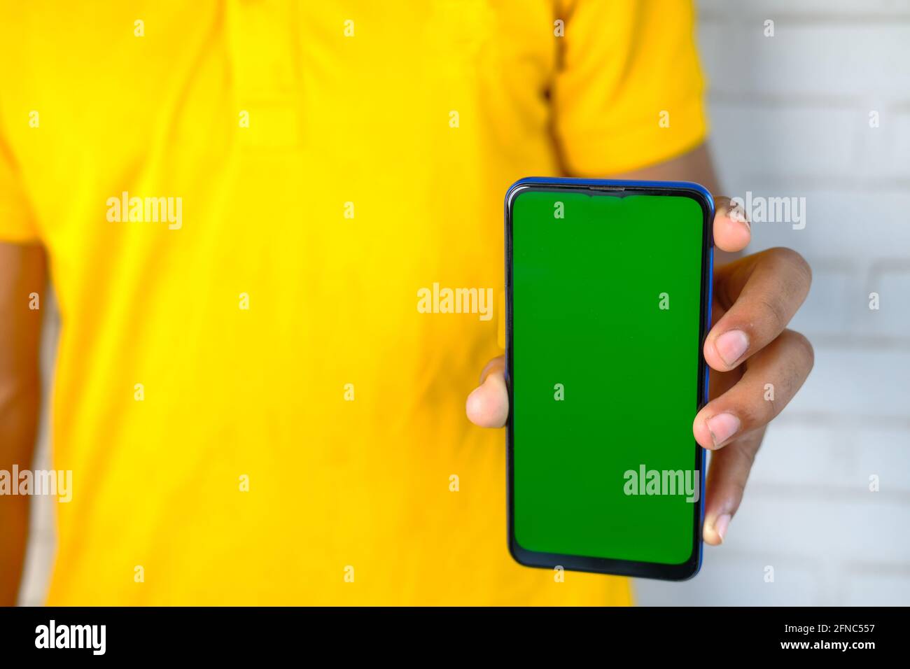 Close up of young man hand using smart phone with green screen Stock ...