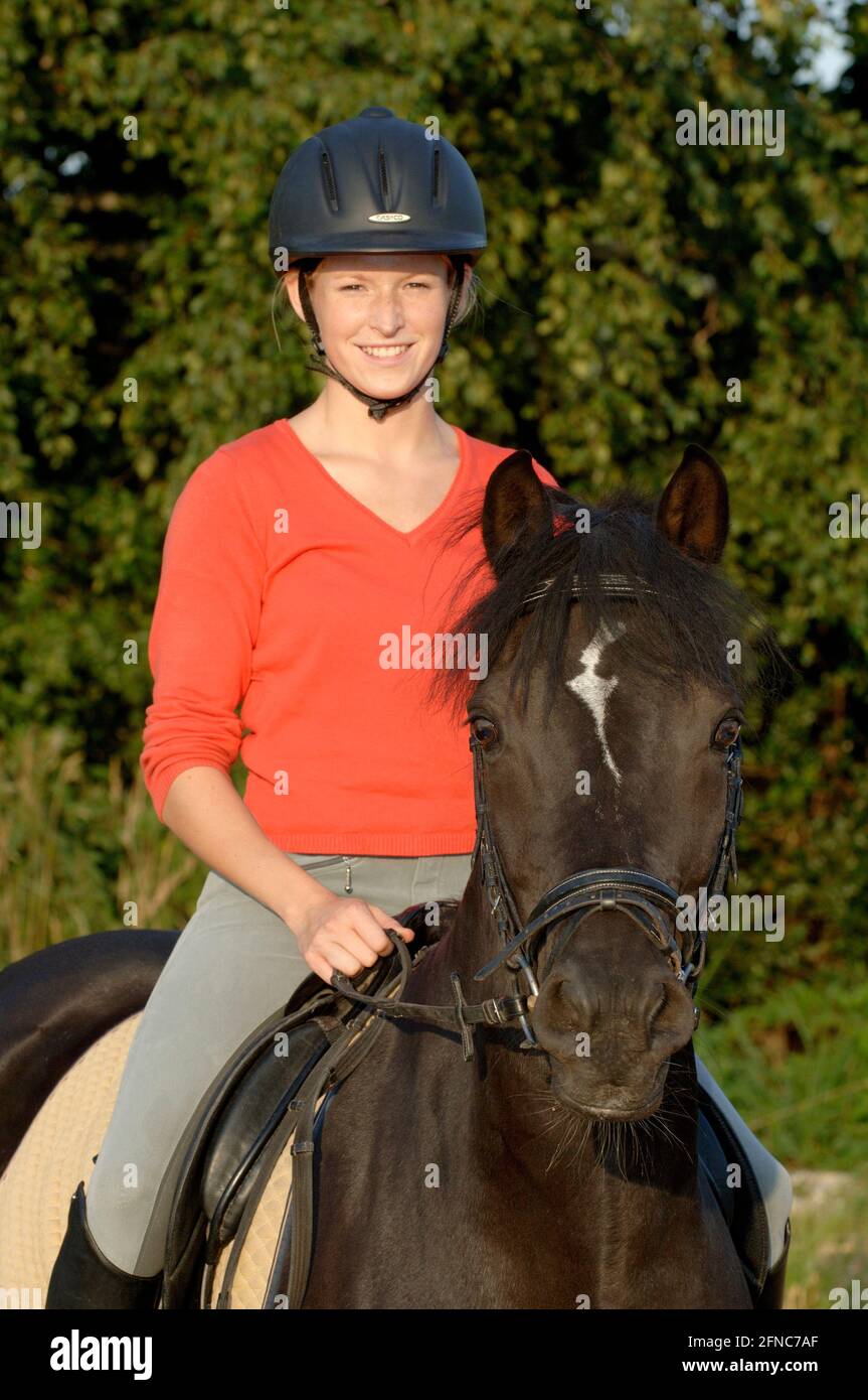 Young  rider on back of a German pony Stock Photo