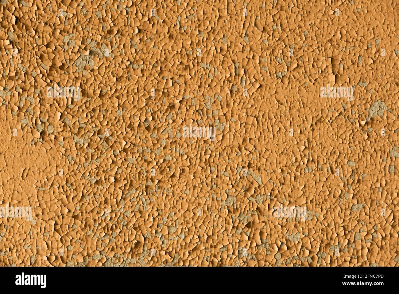 Plastered old wall with cracked and peeling paint. Stock Photo